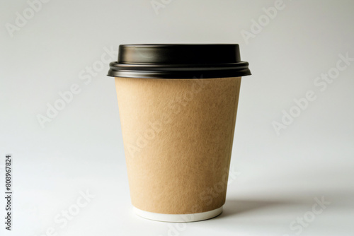 a coffee cup with a lid and a black lid photo