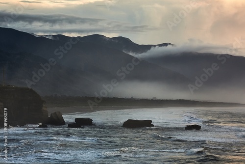 Ocean beach cliffs and mist in New Zealand
