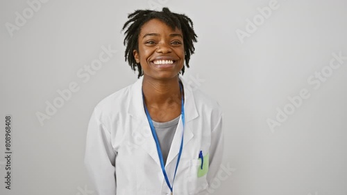 Cheerful and winking black woman with sexy expression, fun times with young scientist over white background photo