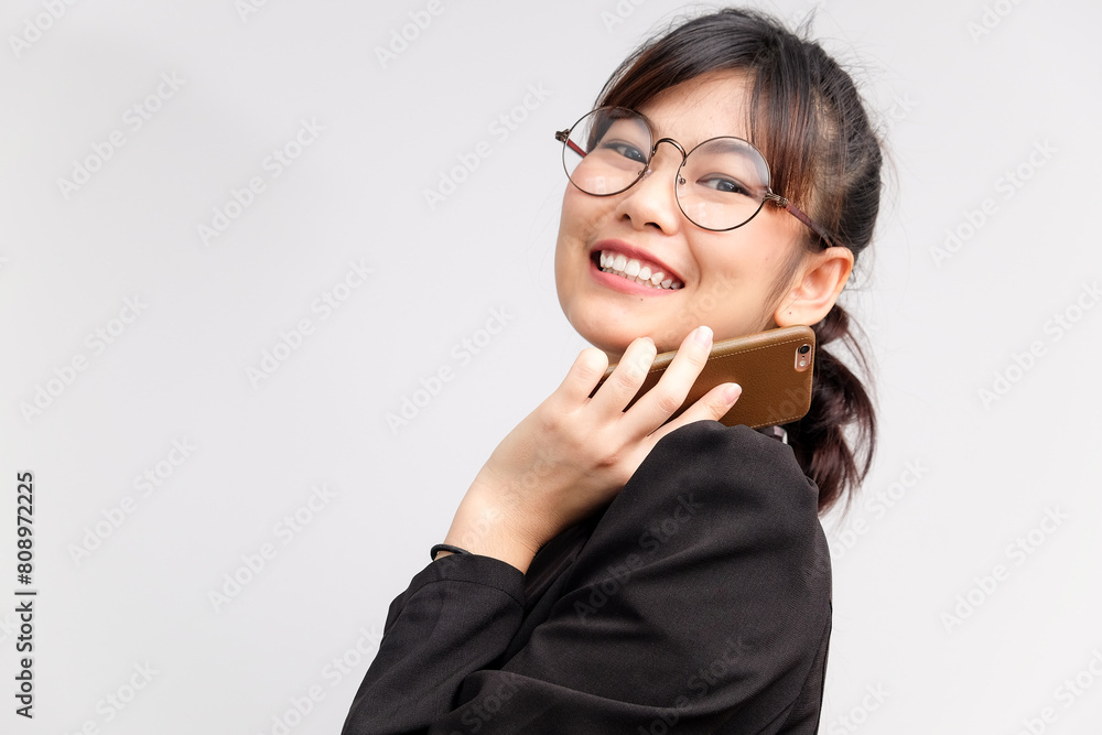 Business asian glasses women use cellphone Business asian glasses women use cellphone