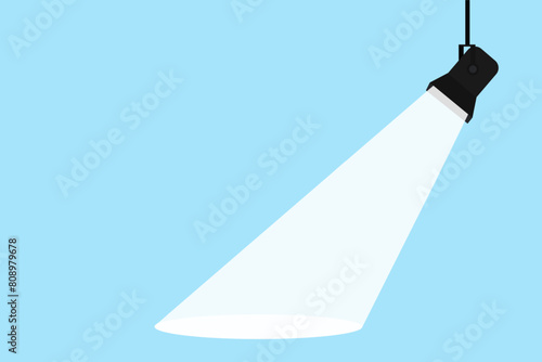 Lamp illumination icon in flat style. Spotlight vector illustration. Movie spotlight. Vector flat spotlight on blue background with space for text.
