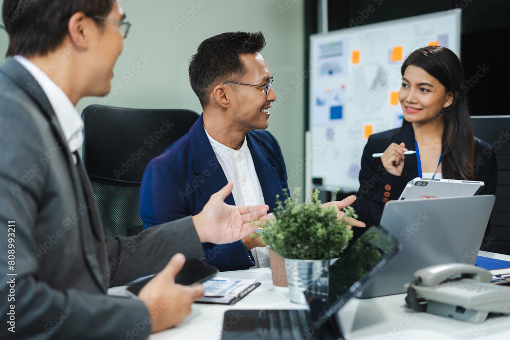 Business corporate team brainstorming, planning strategy having a discussion Analysis investment researching with chart at office desk documents in office. Business corporate team brainstorming, planning strategy having a discussion Analysis investment researching with chart at office desk documents in office.