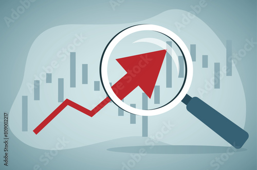 Concept of economic growth with chart and magnifying glass