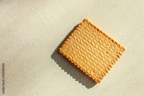 A single square biscuit cake lying on the counter