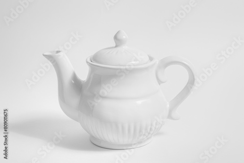 White teapot, isolated on white background. high key black and white photography