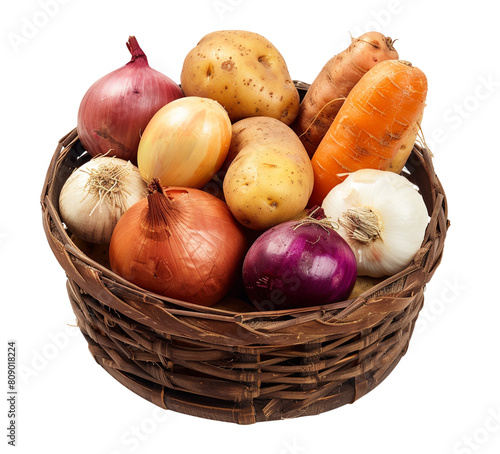 Root vegetables like potatoes and onions displayed in a wooden basket, isolated.

