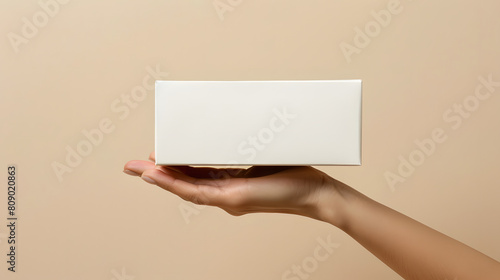 product box dimensions 14.5 x 7.5cm photo of hand holding verticle box in a plain neutral cream background coming from right side 1:1 photo