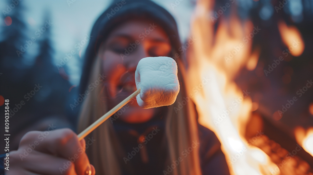 Person Roasting Marshmallows Over Campfire on Sandy Beach
Person Roasting Marshmallows Over Campfire on Sandy Beach