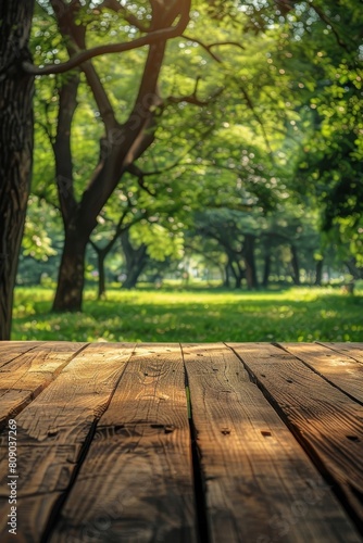 A vacant wooden tabletop set against a backdrop of a lush green garden  ideal for showcasing or incorporating your merchandise.