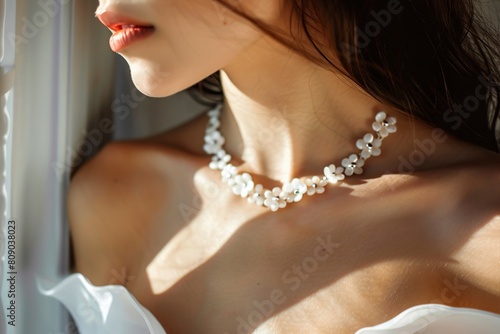an elegant jewelry model in white necklace