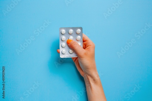 Wallpaper Mural Female hand holds pills in a package Torontodigital.ca