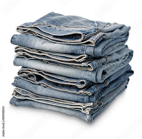 Stack of folded aged blue denim jeans