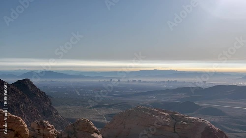 Stunning aerial view of a hazy Las Vegas with mountains in the background in early morning. Taken from the Calico Tanks Trail - Red Rock Canyon National Conservation Area, Nevada, USA
