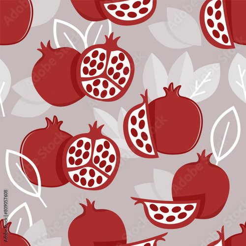 Seamless pattern of flat pomegranate fruits and leaves on a gray background