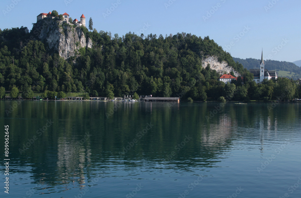 Photo of a view of Lake Bled, Bled Castle on the rock and St. Martin's Church in the town of Bled, near Ljubljana, Slovenia