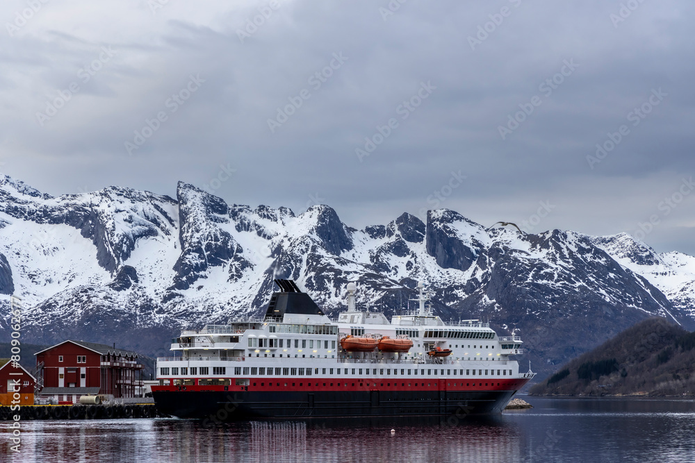 cruise ship leaves the port of Ornes in Nordland province in Norway