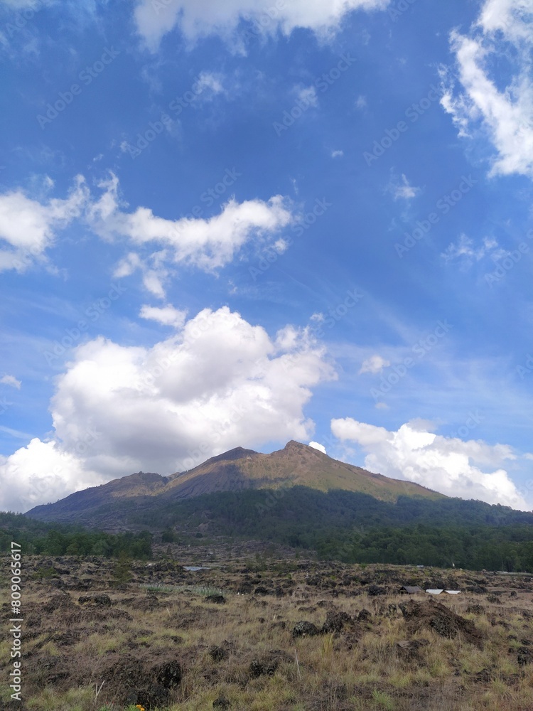 View of Mount Batur, an active volcano, on the island of Bali, Indonesia, on a sunny day
