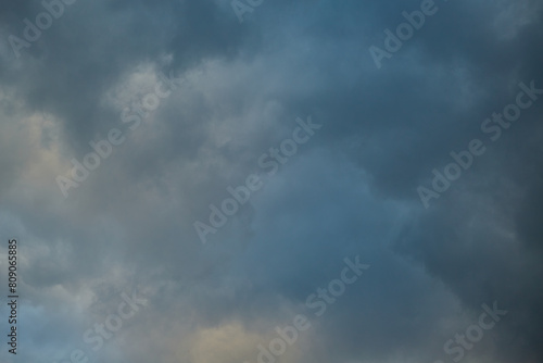 A close-up of a storm cloud, overcast sky, dramatic sky before the rain, shades of light in the storm cloud, close-up
