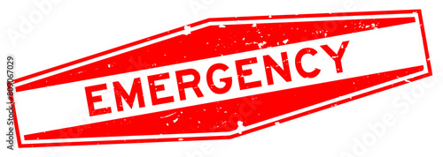 Grunge red emergency word hexagon rubber seal stamp on white background