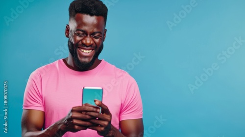 Man Smiling at Smartphone Screen photo