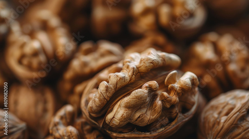 A close up of walnuts with the nut shells showing