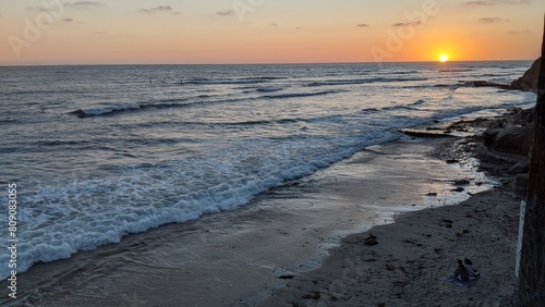 Southern California beach scenes with sunsets  surfers  tide pools  rocks and palms trees in Encinitas California.