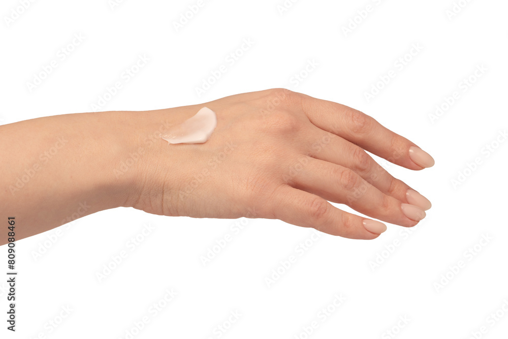 Beige cream tube in woman hands isolated on a white background. Cream swatch on woman hand.