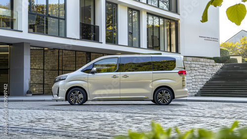 adopt a new concept MPV for its first luxury car, front quarter view, parked in front of a modern photo