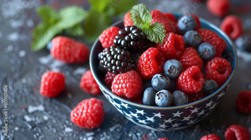 A bowl of mixed berries  including raspberries and blueberries