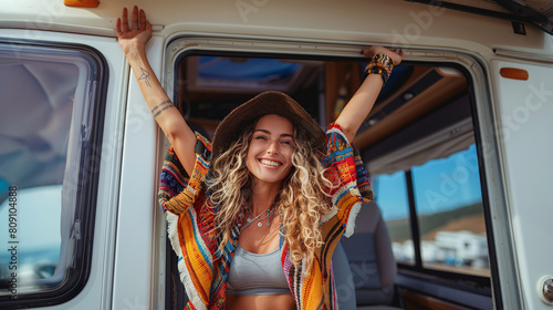 happy younh caucasian woman ready to conquer the day with her RV motorhome, off-grid lifestyle, vacations photo