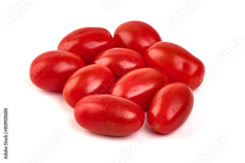 Heap of fresh cherry tomatoes, isolated on white background