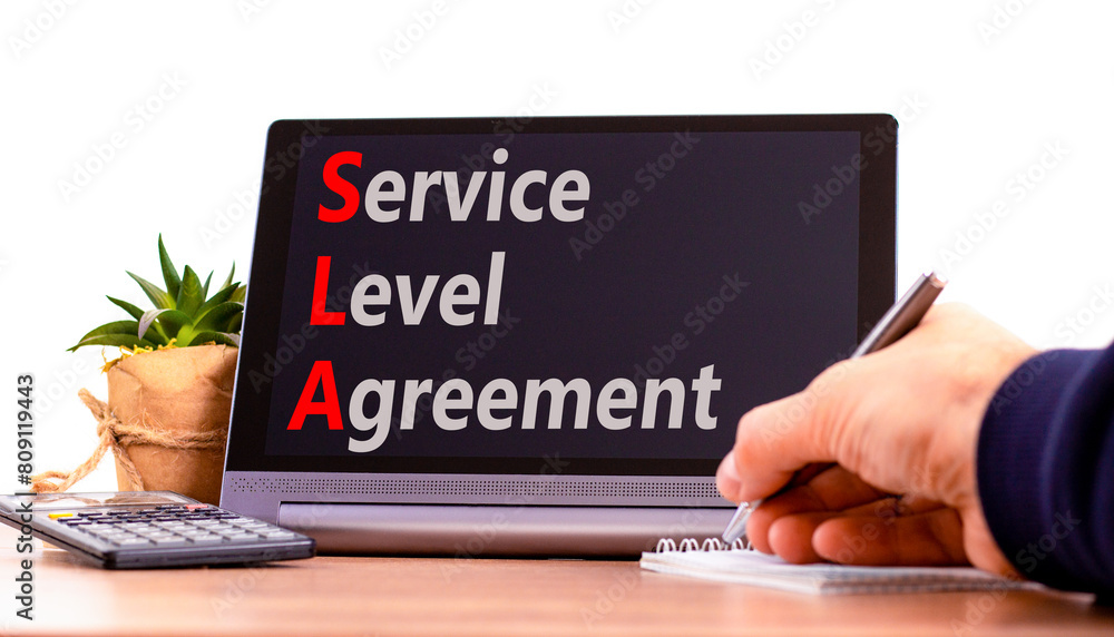 SLA service level agreement symbol. Concept words SLA service level agreement on beautiful black tablet. Beautiful white background. Business SLA service level agreement concept. Copy space. SLA service level agreement symbol. Concept words SLA service level agreement on beautiful black tablet. Beautiful white background. Business SLA service level agreement concept. Copy space.
