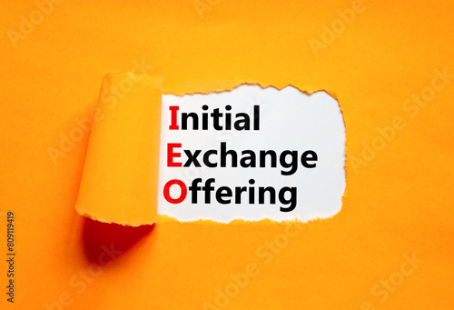 IEO initial exchange offering symbol. Concept words IEO initial exchange offering on beautiful paper. Beautiful orange paper background. Business IEO initial exchange offering concept. Copy space.
