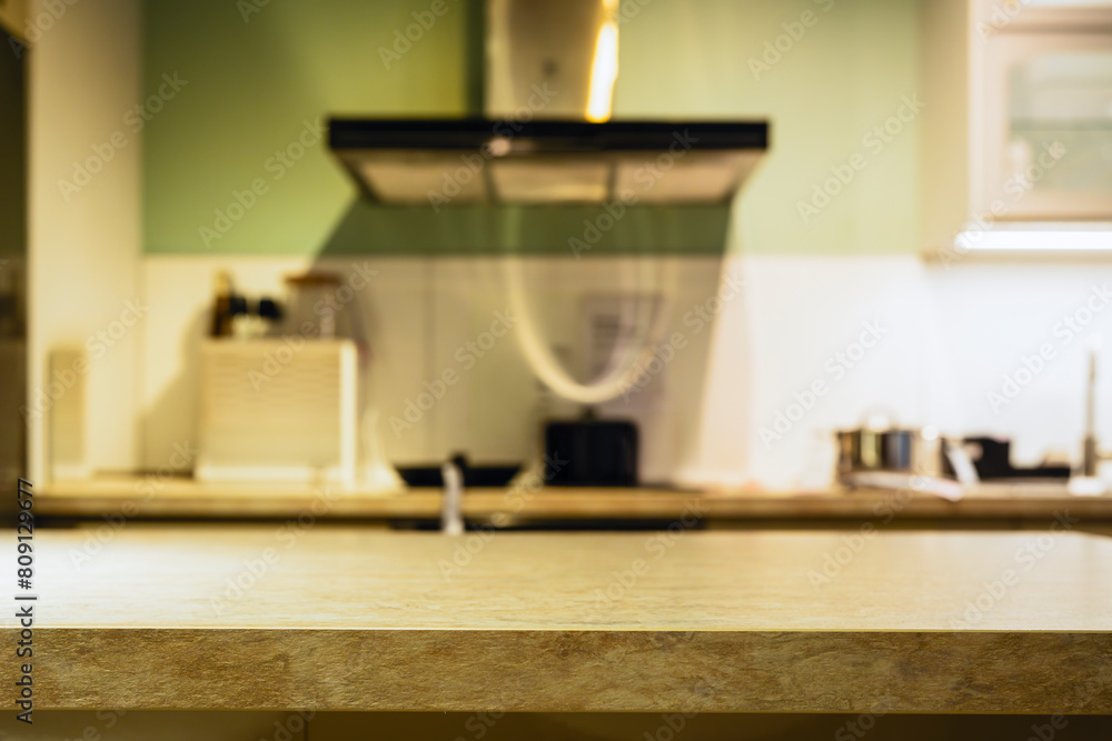 Wood table with blur kitchen room background .For montage product display or design key visual layout. Wood table with blur kitchen room background .For montage product display or design key visual layout.