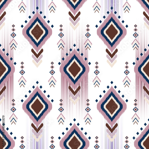 Ethnic Ikat fabric pattern geometric style. Motif Ikat embroidery Ethnic oriental seamless pattern with pink and blue diamons shape on white background.