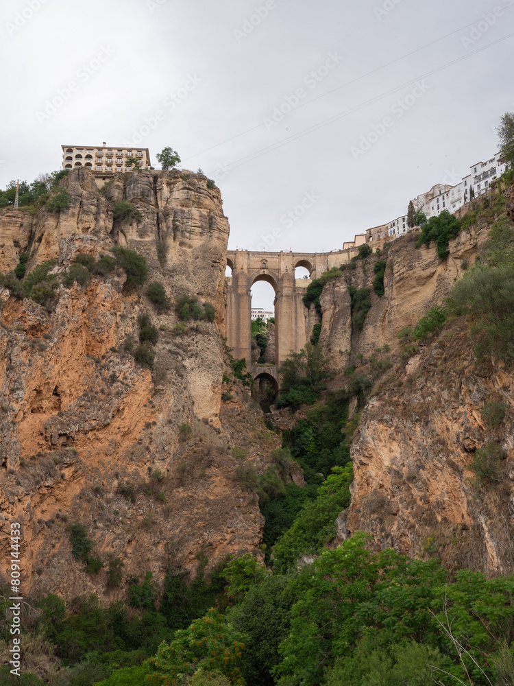 Scenic views Puente Nuevo bridge from Mirador La Hoya Del Tajo lookout in Ronda in the Andalusia region of southern Spain Scenic views Puente Nuevo bridge from Mirador La Hoya Del Tajo lookout in Ronda in the Andalusia region of southern Spain