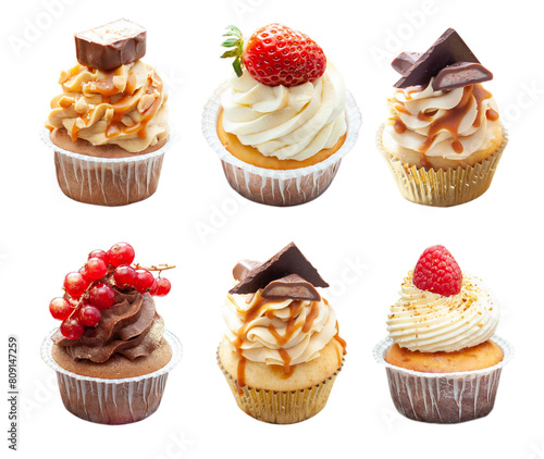 Set of chocolate, vanilla and salted caramel cupcakes with fresh berries and peanuts isolated on white background, png