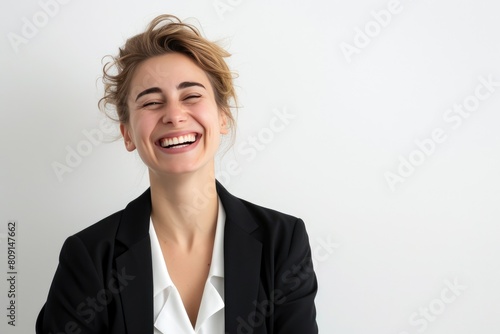 Joyous Female Executive Against White Backdrop