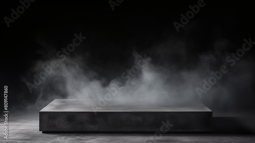 Concrete platform, podium or table with smoke in the dark on a black background.