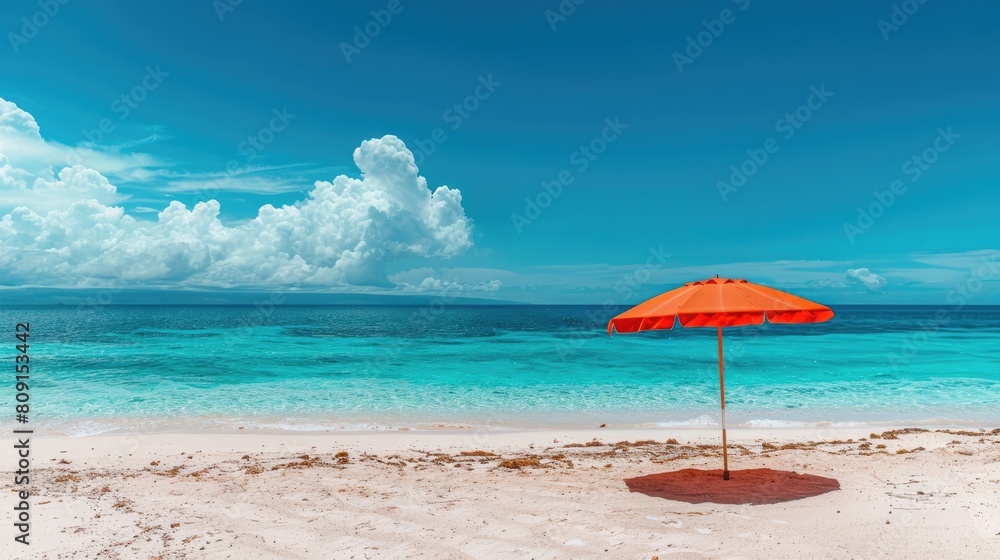 a colorful beach umbrella casting its shade on pristine white sand, against the backdrop of azure skies and crystal-clear turquoise waters, embodying the quintessential essence 