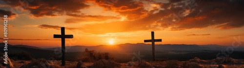 Dramatic sunset over mountain crosses