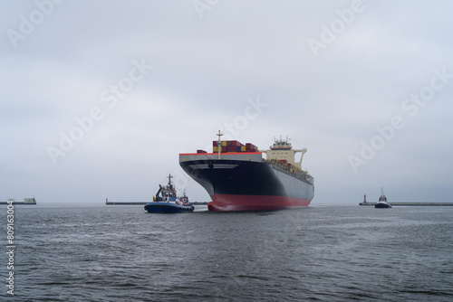 MARITIME TRANSPORT - Container ship sails to the seaport
