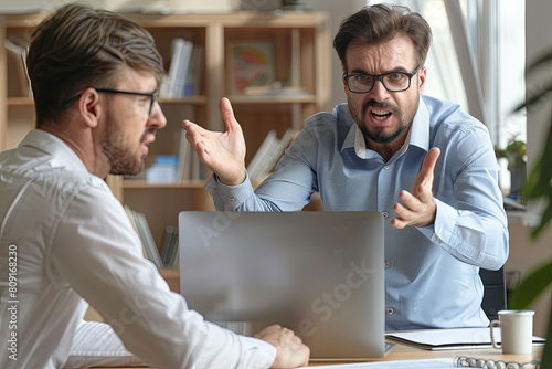 Angry boss criticizing scolding sad male employee for computer mistake incompetence at workplace, mad leader reprimanding rebuking shouting at subordinate lazy worker blaming of bad work in office
 photo