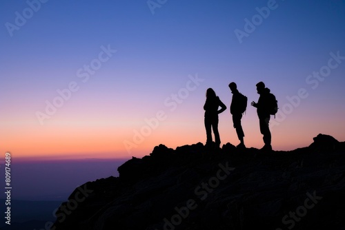 Silhouette of three people talking at dusk on top of mountain Generative AI