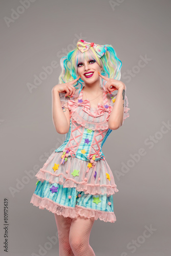Quadro em tela Pretty female clown model in colorful outfit and hair