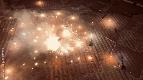 Slow motion of a rolling cracker was sparkling after flamed