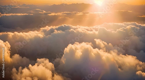 Aerial view of stunning sunset clouds with the sun peeking through the fog, with a realistic digitally produced image and a camera that moves into an exquisite cloudscape with gorgeous light rays