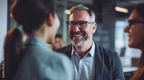 a happy group of business people having a conversation in an office, a businessman wearing glasses and a woman talking to each other. generative AI photo