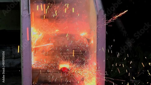 Slow motion effect of a walla fire cracker getting exploded