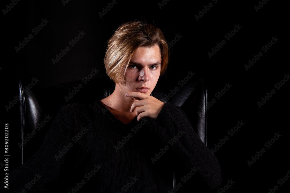 Sad young attractive man relaxing at home. Sad young attractive man relaxing at home.